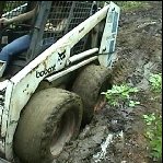 Scarlet Gets the Bobcat Stuck in the Mud