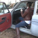 Sasha Cranking the Volvo in Leather Jacket & Boots