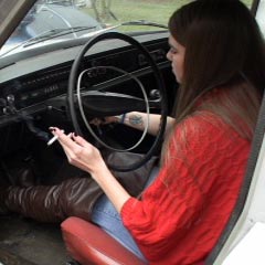 Kristen Trying to Start the Volvo in Boots & Smoking