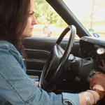 Audrey Moving Some Cars Around Denim & Boots, 1 of 3