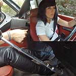 Hana Cranks & Revs the Volvo in Leather Pants & Boots, 1 of 2